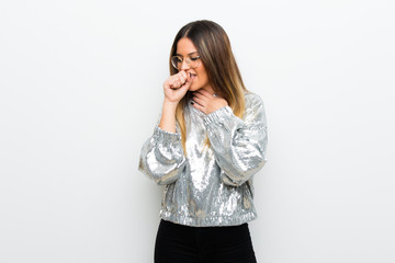 Fototapeta premium Young woman with glasses over white wall is suffering with cough and feeling bad