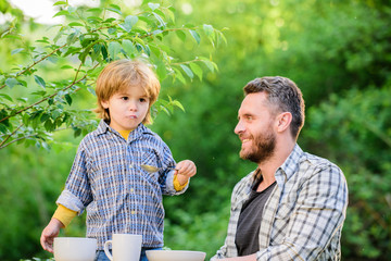 Happy family together. childhood happiness. Food habits. happy fathers day. Little boy with dad. Preparation of food. healthy food and dieting. son and father eating milk porridge. Summer taste