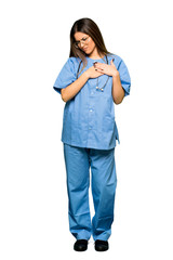 Full body of Young nurse having a pain in the heart