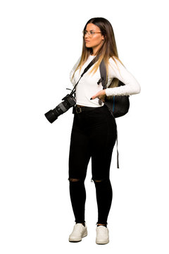 Full body of Young photographer woman suffering from backache for having made an effort