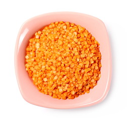 Red lentils with bowl isolated on white