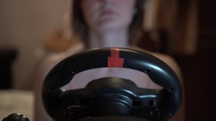 girl playing car simulator in home