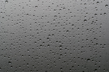 Rain drops on window glasses natural pattern of raindrops background
