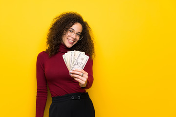 Dominican woman with turtleneck sweater taking a lot of money