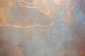 The concrete texture surface is rough, rusty red. Natural wall plaster gray.