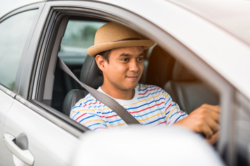 Young asian man driving car. Relaxing, Holiday, Activities, travel, Insurance agent concept.