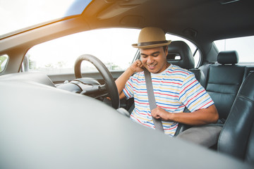 Naklejka premium Young asian man driving car. Relaxing, Holiday, Activities, travel, Insurance agent concept.
