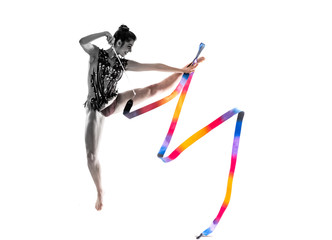 Girl doing rhythmic gymnastics with ribbon . jumping