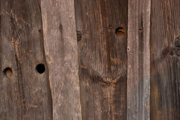 Beautiful patterns on the close-up of old wood. The knot in the board