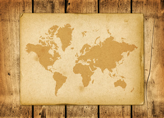 Vintage world map parchment on a wooden wall