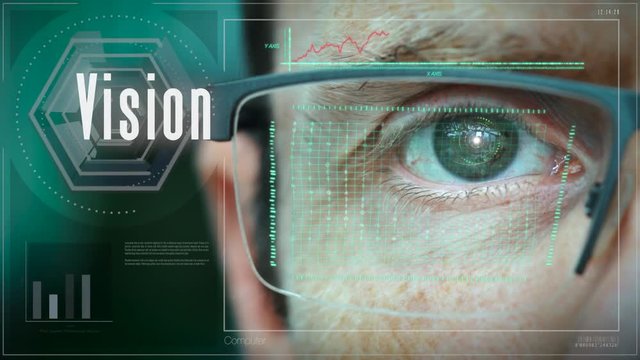 A close up of a businessman eye controlling a futuristic computer system with a Vision concept.