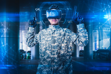 The abstract image of the soldier use a VR glasses for combat simulation training overlay with the hologram. the concept of virtual hologram, simulation, gaming, internet of things and future life.