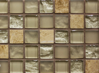 background mosaic tile of brown and beige squares of different tones and transparency monochromatic and with texture and ornament