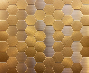 background wall mosaic in the form of honeycombs gold and silver ceramic textured metal