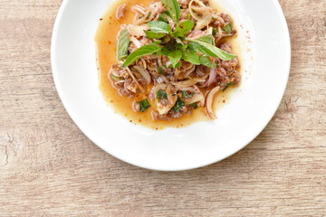 Thai spicy minced pork salad and basil on plate