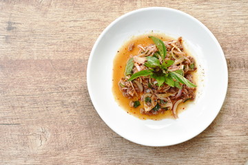 Thai spicy minced pork salad and basil on plate