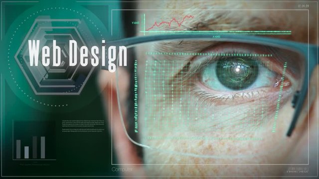 A close up of a businessman eye controlling a futuristic computer system with a Web Design concept.