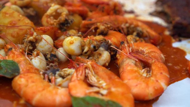Seafood bucket prawn, squid, mussel with red cajun suace