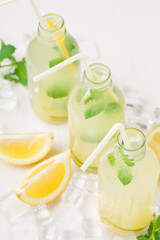 Obraz na płótnie Canvas Homemade lemonade with fresh lemon and mint