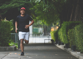 Fototapeta premium Healthy runner jogging outdoor. Fitness and sport healthy lifestyle concept.