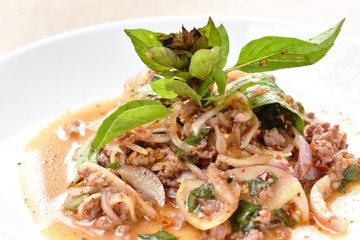 Thai spicy minced pork salad and basil on plate