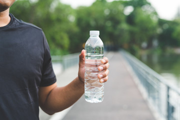 Man holding bottle of water