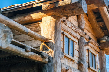 Ecological wooden house. Wooden house with meadow in front of it. Beautiful modern wooden house.