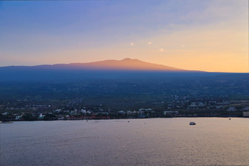 wide shot of ocean with island mountains in the distance