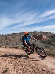 Woman mountain biking on single track in Fruita, Colorado