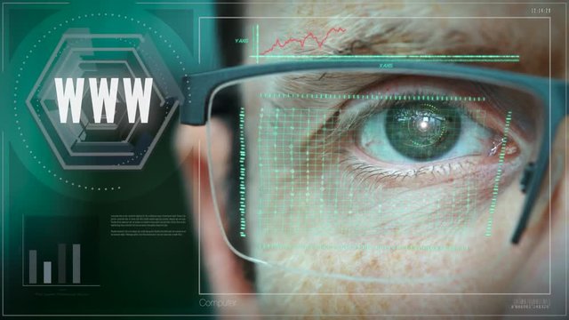 A close up of a businessman eye controlling a futuristic computer system with a WWW Business concept.