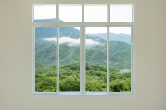 Fototapeta Modern house window view with mountain background