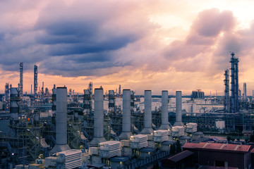 Factory of oil and gas refinery industrial plant at evening, Manufacturing of petroleum industrial plant, Smoke stacks of power plant