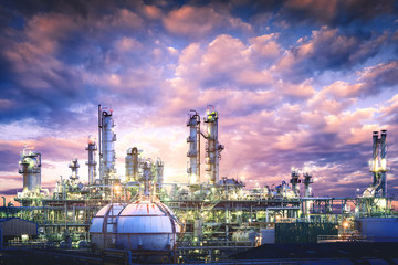 Oil and gas refinery plant or petrochemical industry on sky sunset background, Gas storage sphere...