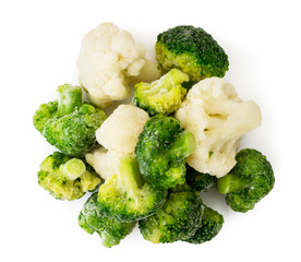 Frozen broccoli and cauliflower on a white. The form of the top.