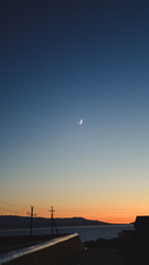 sunset on the sea the moon shines