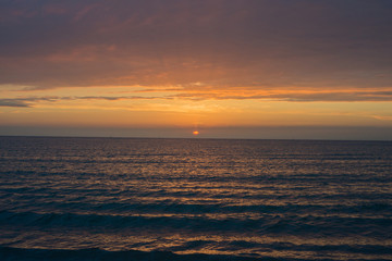 Fototapeta premium Beautiful sunset over the sea. Bright sunset sky with clouds. Black sea, Anapa, Krasnodar region, Russia