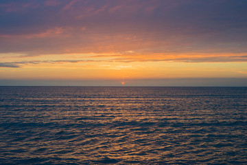 Fototapeta premium Beautiful sunset over the sea. Bright sunset sky with clouds. Black sea, Anapa, Krasnodar region, Russia