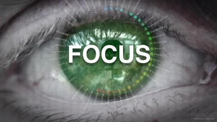 Close up of an eye focusing on a Focus concept on a futuristic screen.