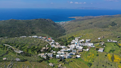 Fototapeta na wymiar Aerial drone spring photo of picturesque beautiful twin villages of Ktikados and Hatzirados with traditional architecture overlooking seaside village of Kionia, Tinos island, Cyclades, Greece