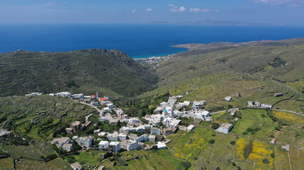 Fototapeta na wymiar Aerial drone spring photo of picturesque beautiful twin villages of Ktikados and Hatzirados with traditional architecture overlooking seaside village of Kionia, Tinos island, Cyclades, Greece