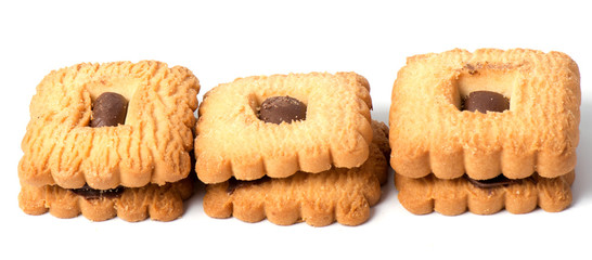 Peanut butter cookie on a white background. Golden homemade biscuit with a missing bite and trail of crumbs.