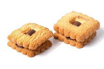 Peanut butter cookie on a white background. Golden homemade biscuit with a missing bite and trail of crumbs.