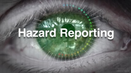 Close up of an eye focusing on a Hazard Reporting on a futuristic screen.
