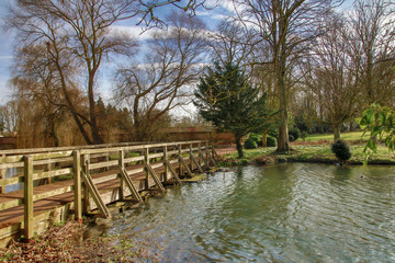 Wooden footbridge over lake