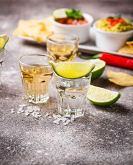 Shots of silver and gold tequila
