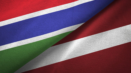Gambia and Latvia two flags textile cloth, fabric texture