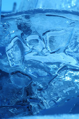 the sun's rays are refracted in crystal clear pieces of ice. winter landscape. Lake Baikal