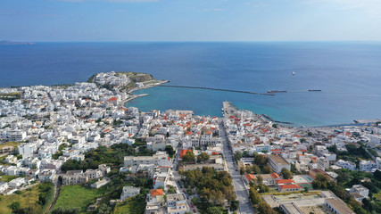 Fototapeta na wymiar Aerial drone photo of iconic main town and port of Tinos island featuring monastery of Panagia Megalochari (Virgin Mary), Cyclades, Greece