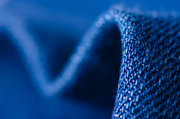 Blue jeans fabric cloth material texture textile macro blur background © Kabardins photo