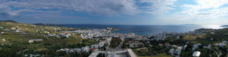 Fototapeta na wymiar Aerial drone photo of iconic main town and port of Tinos island featuring monastery of Panagia Megalochari (Virgin Mary), Cyclades, Greece